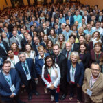 A group shot of a large number of attendees posing for a picture