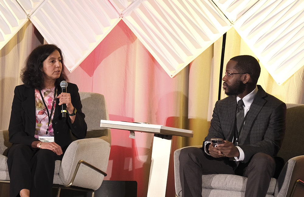 Suma Konety, MD, MS, left, speaks with Daniel Addison, MD at GCOS 2024