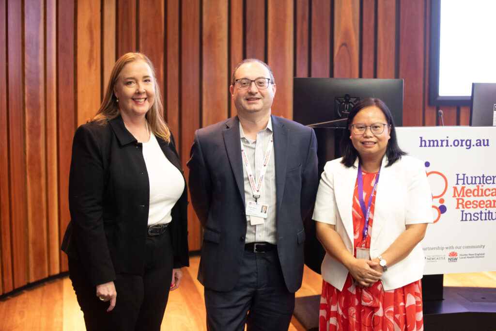 From left to right: The Hon Jenny Aitchison MP, a middle aged white woman with blonde hair; Aaron Sverdlov, a middle aged man with a buzz cut sporting a suit; Doan Ngo, an asian woman with medium black hair and a red dress with a white blouse 