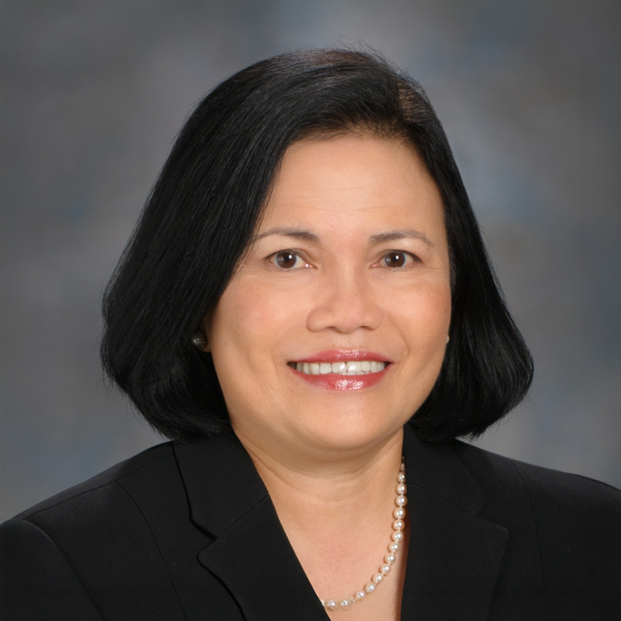 Anecita Fadol, a hispanic woman in a with medium dark hair and a black blazer