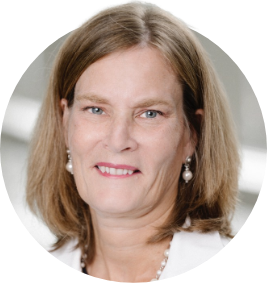 susan dent circle Susan Dent, a white woman with light brown hair and pearl jewelry smiles against a clinical background