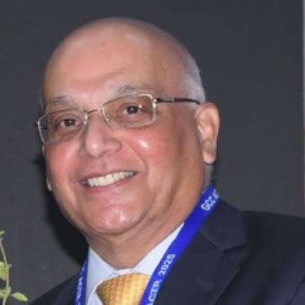 Vivek M. Rangnekar, MD, a cardio-oncologist in Lexington, Kentucky. He is an older adult white man with glasses and short grey hair, wearing a suit and a lanyard